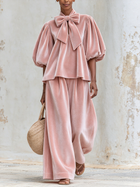 Mónica | Conjunto rosa con blusa de lazo y pantalón ancho