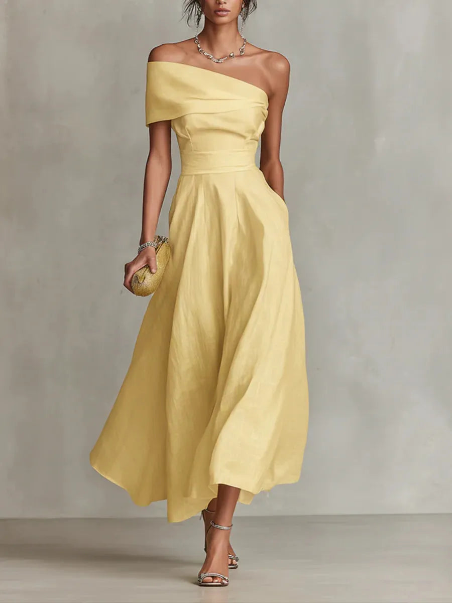 Maribel | Vestido largo amarillo de invitada con corte asimétrico