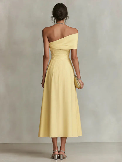Maribel | Vestido largo amarillo de invitada con corte asimétrico
