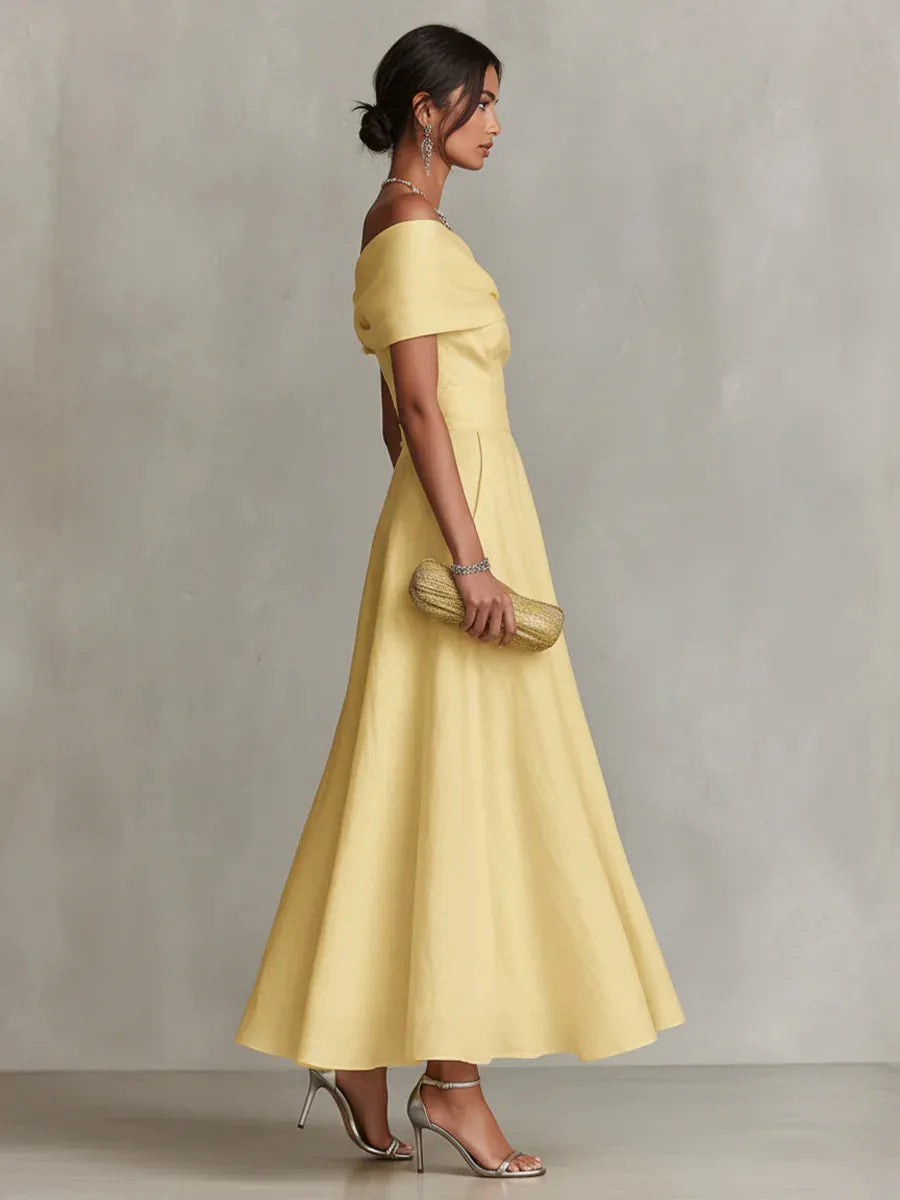 Maribel | Vestido largo amarillo de invitada con corte asimétrico