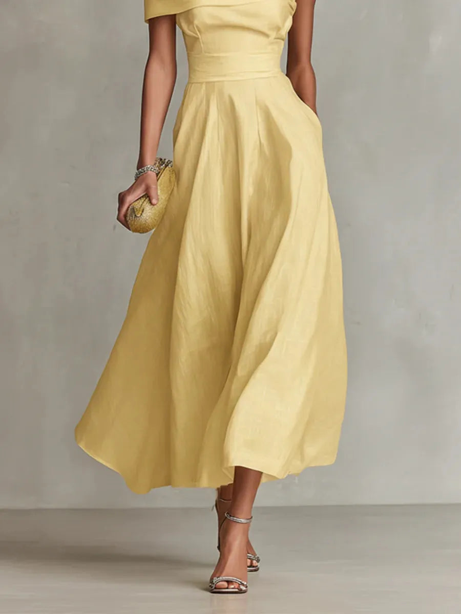 Maribel | Vestido largo amarillo de invitada con corte asimétrico