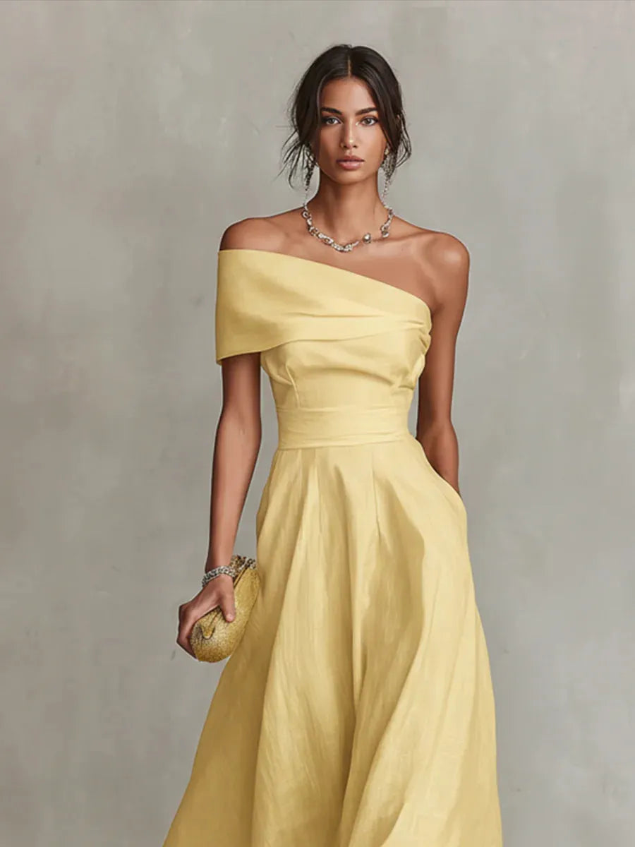 Maribel | Vestido largo amarillo de invitada con corte asimétrico