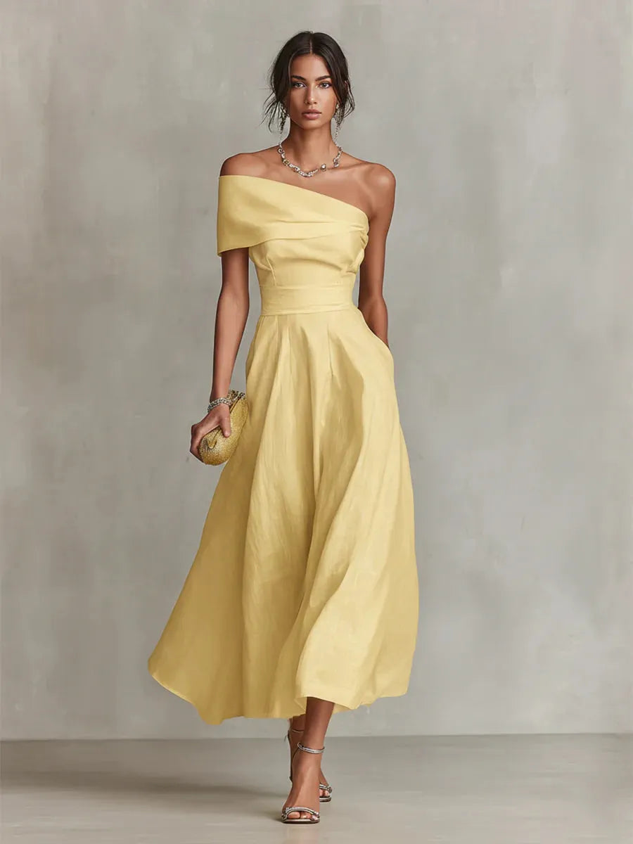 Maribel | Vestido largo amarillo de invitada con corte asimétrico